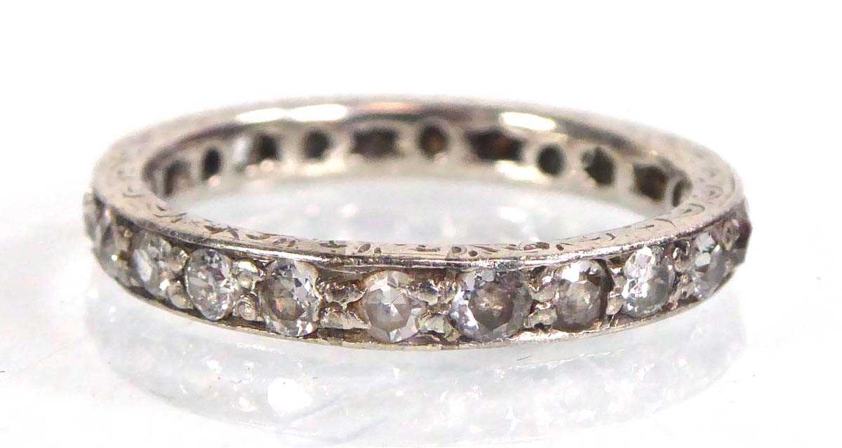 Lot 517 - A white metal eternity ring set small diamonds...