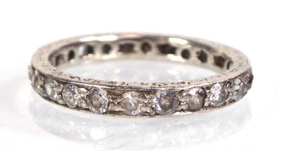 Lot A white metal eternity ring set small diamonds...