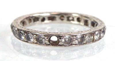 Lot 517 - A white metal eternity ring set small diamonds...