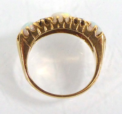 Lot 519 - An 18ct yellow gold ring set three graduated...