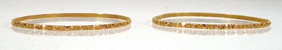 Lot 525 - A pair of Indian yellow metal facet cut...