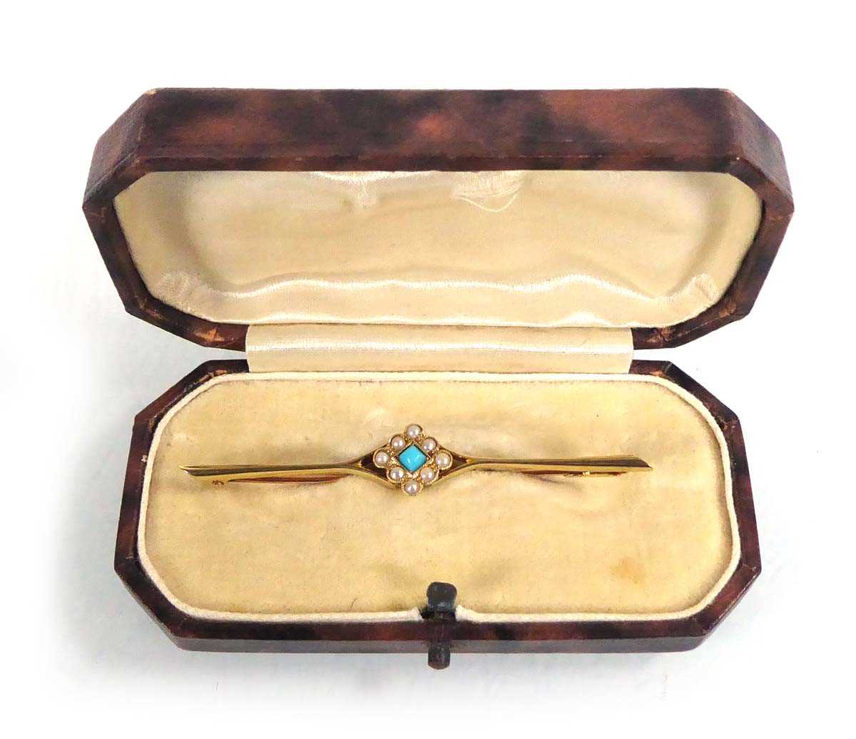 Lot 532 - A 15ct yellow gold bar brooch set a turquoise...