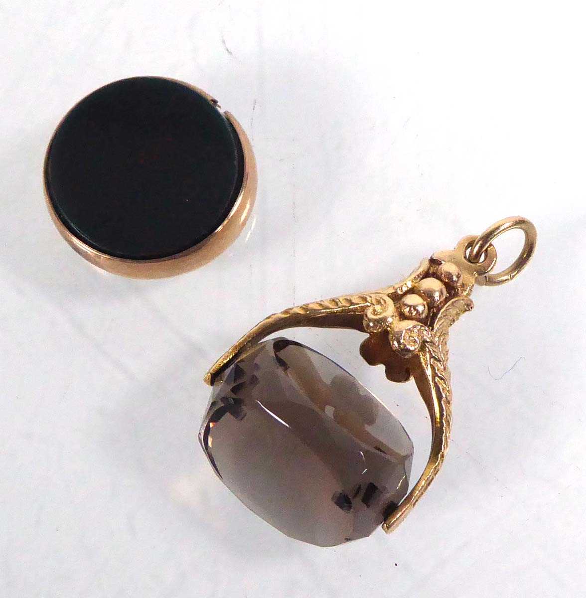 Lot 535 - A 9ct yellow gold swivel fob set smoky quartz,...