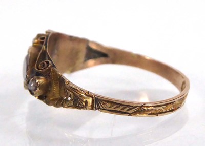 Lot 542 - An Edwardian 9ct yellow gold ring set two...