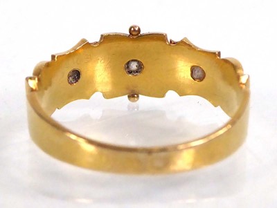 Lot 545 - An Edwardian 18ct yellow gold ring set three...