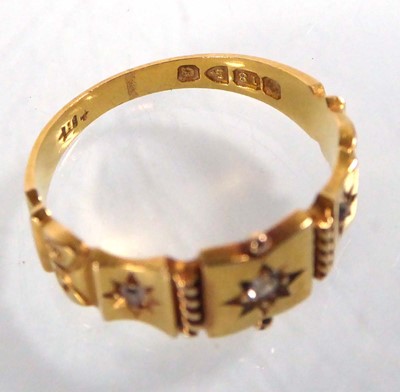 Lot 545 - An Edwardian 18ct yellow gold ring set three...