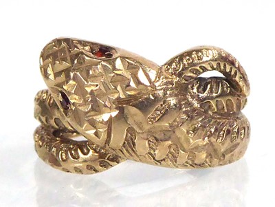 Lot 554 - A 9ct yellow gold ring of serpent form, its...