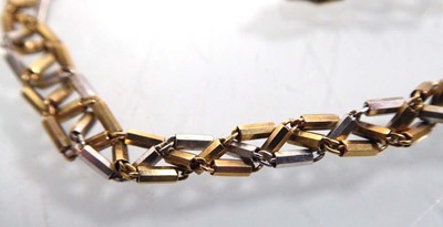 Lot 559 - A 9ct two colour triangular link necklace with...