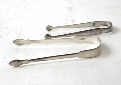 Lot 409 - Two pairs of Georgian silver sugar tongs....