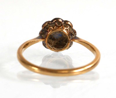 Lot 567 - A yellow metal cluster ring set sapphire and...