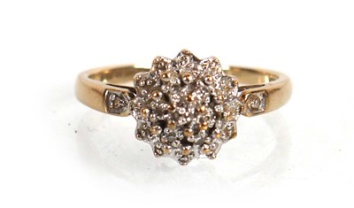 Lot 573 - A 9ct yellow gold cluster ring set small...