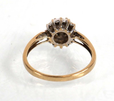 Lot 573 - A 9ct yellow gold cluster ring set small...