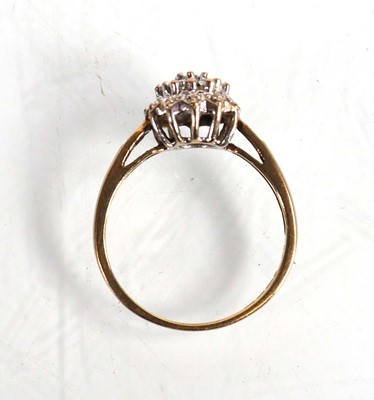 Lot 573 - A 9ct yellow gold cluster ring set small...