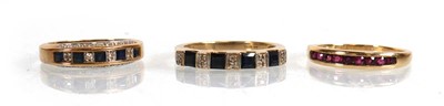 Lot 574 - A 9ct yellow gold half eternity ring set four...