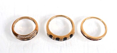 Lot 574 - A 9ct yellow gold half eternity ring set four...