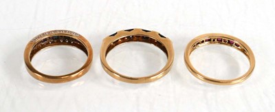 Lot 574 - A 9ct yellow gold half eternity ring set four...