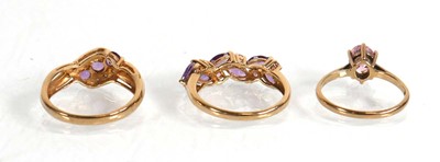 Lot 576 - A 9ct yellow gold crossover ring set three...