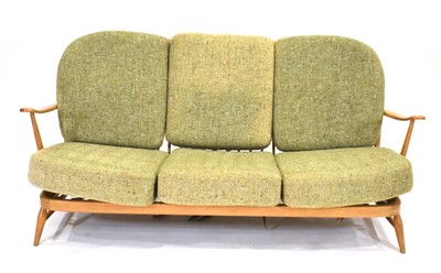 Lot 42 - An Ercol beech framed three-seater 203 sofa...