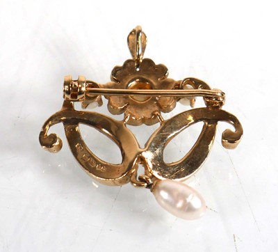 Lot 584 - A 9ct yellow gold pendant brooch of Rococo...