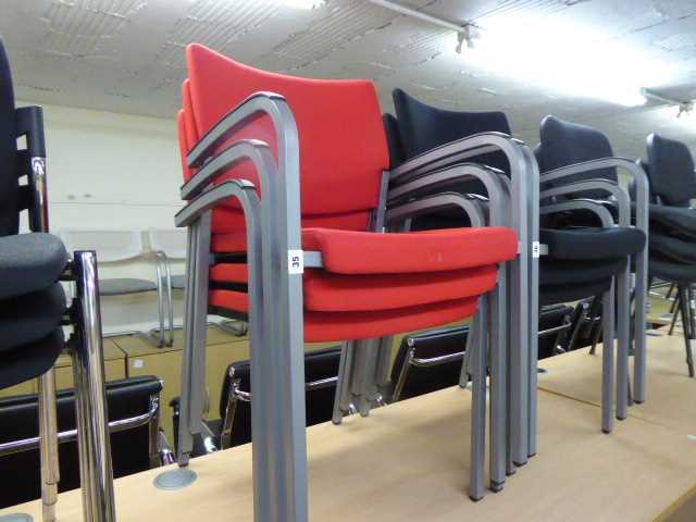 Lot 35 - Set of 3 Faefe red cloth stacking chairs