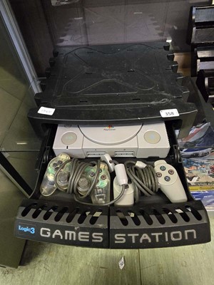 Lot 358 - A Logic3 Games Station case containing a Sony...