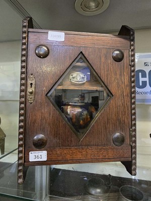 Lot 361 - A 20th century oak smokers cabinet, the door...