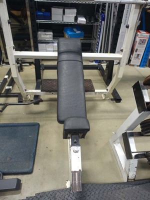 Lot 3009 - Incline bench plus Olympic bar and spotting plate