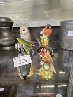 Lot 365 - An assortment of seven ceramic figurines of...