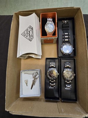 Lot 406 - A box containing modern wristwatches, white...