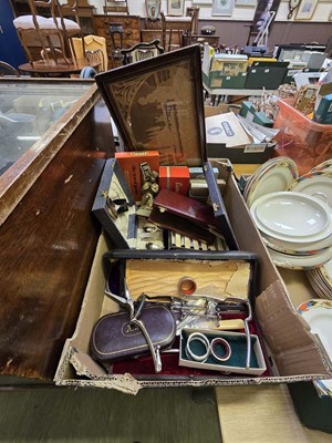 Lot 424 - A box containing cased flatware, nutcrackers,...