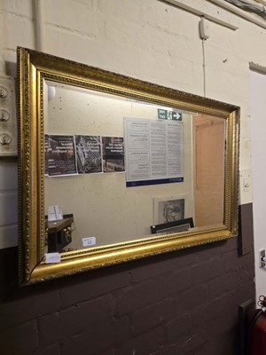 Lot 12 - A rectangular gilt framed bevel glass wall mirror