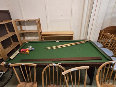 Lot 19 - A pool table along with cues, balls, chalk, etc