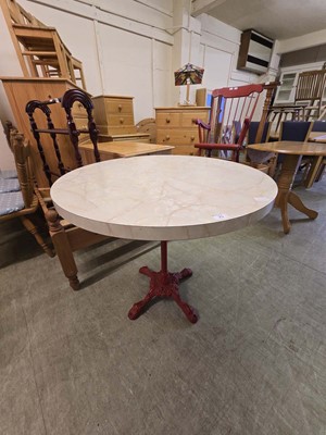 Lot 25 - A red painted cast metal pub table with a...