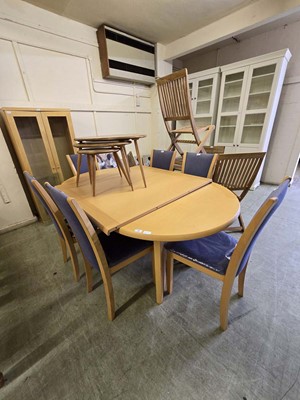 Lot 38 - A modern extending dining table with two extra...