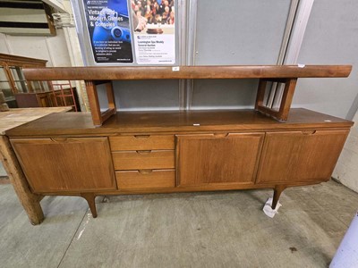 Lot 48 - A mid-20th century teak sideboard having two...