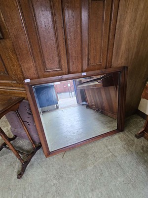 Lot 63 - A mahogany framed bevel glass wall mirror