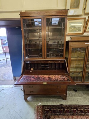 Lot 66 - An Edwardian mahogany inlaid bureau bookcase...