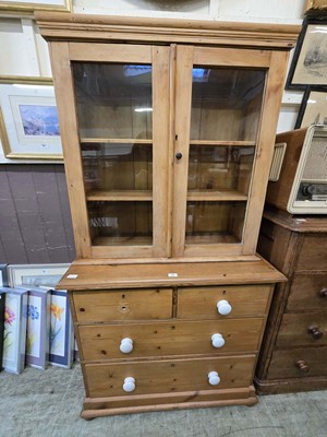 Lot 88 - A waxed pine chest of two short over two long...