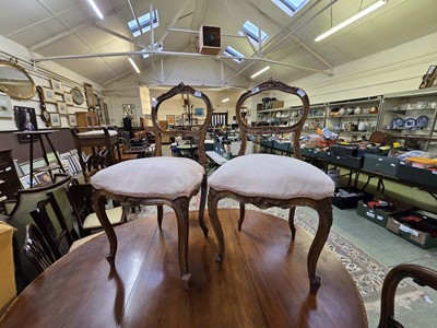 Lot 122 - A pair of Victorian walnut framed balloon back...