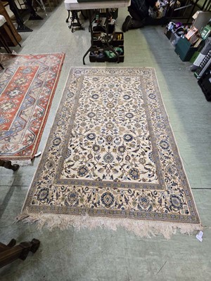 Lot 123 - A rectangular Chinese style cream and blue rug