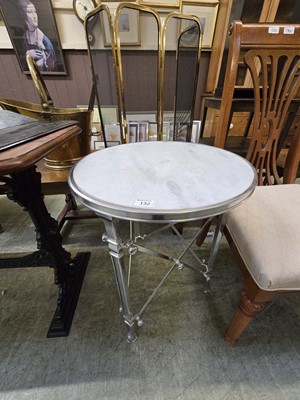 Lot 132 - A modern polished aluminium based circular...