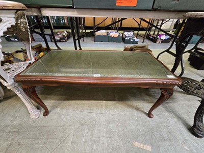 Lot 138 - A reproduction walnut coffee table with a...