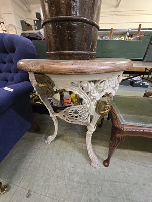 Lot 140 - A cream painted cast iron pub table with a...