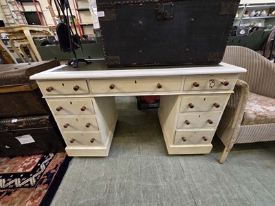 Lot 145 - A cream painted twin pedestal desk