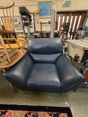 Lot 157 - A blue leather upholstered chair on stylish...