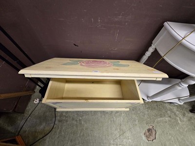 Lot 180 - A cream and floral decorated wooden toy chest