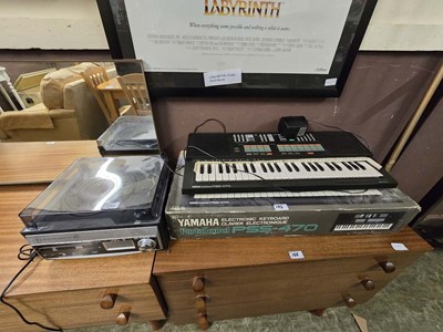 Lot 193 - A Yamaha Portasound PSS-470 keyboard together...