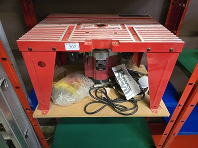 Lot 207 - A router bench together with a Power Devil router