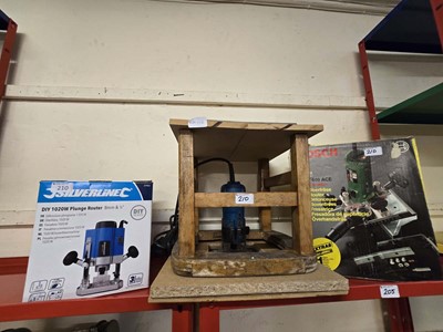 Lot 210 - A boxed Bosch router together with a boxed...