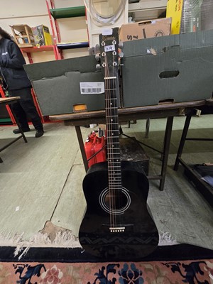 Lot 219 - A black acoustic guitar by Encore model no....